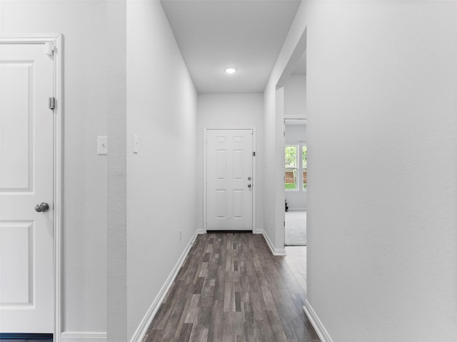 2715 Marguerite St, Bay City, TX 77414 - hallway with dark wood-style flooring, baseboards, and recessed lighting