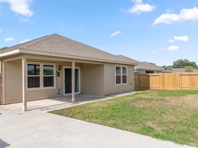 2715 Marguerite St, Bay City, TX 77414 - back of house featuring a patio and roof with shingles