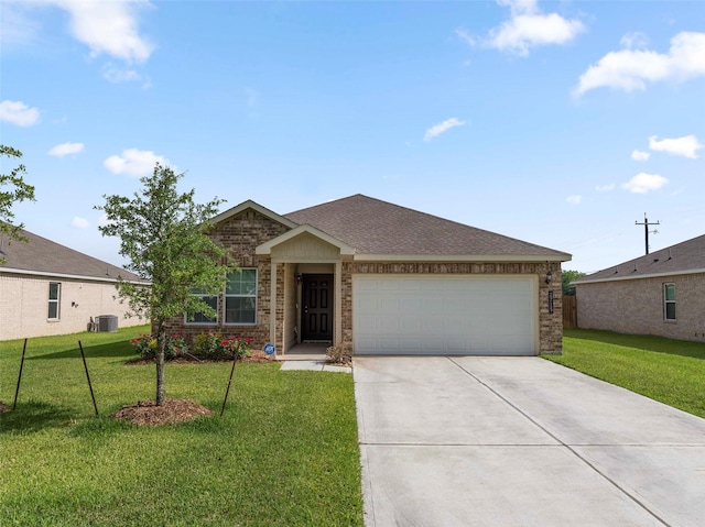 2715 Marguerite St, Bay City, TX 77414 - single story home with a front lawn, driveway, a garage, brick siding, and cooling unit