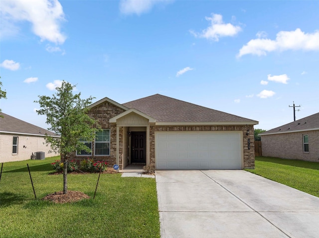 2715 Marguerite St, Bay City, TX 77414 - ranch-style house featuring brick siding, central air condition unit, driveway, an attached garage, and a front lawn