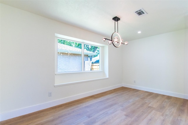 2402 N Ferrisburg Ct, Sugar Land, TX 77478 - unfurnished room featuring a chandelier, light wood-style floors, baseboards, and recessed lighting