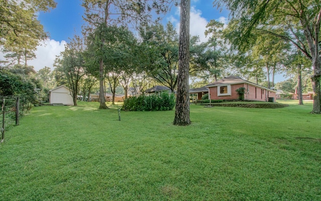 24806 Silver Leaf St, Magnolia, TX 77355 - view of yard featuring a storage unit and an outdoor structure