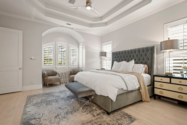3702 Deerbend Ct, Spring, TX 77386 - bedroom with a tray ceiling, wood finished floors, ornamental molding, and a ceiling fan