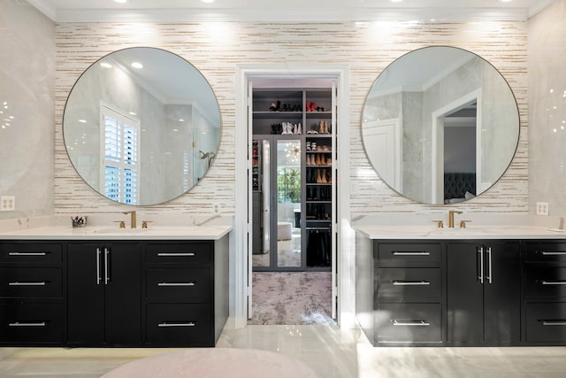 3702 Deerbend Ct, Spring, TX 77386 - bathroom featuring crown molding, two vanities, tasteful backsplash, and recessed lighting