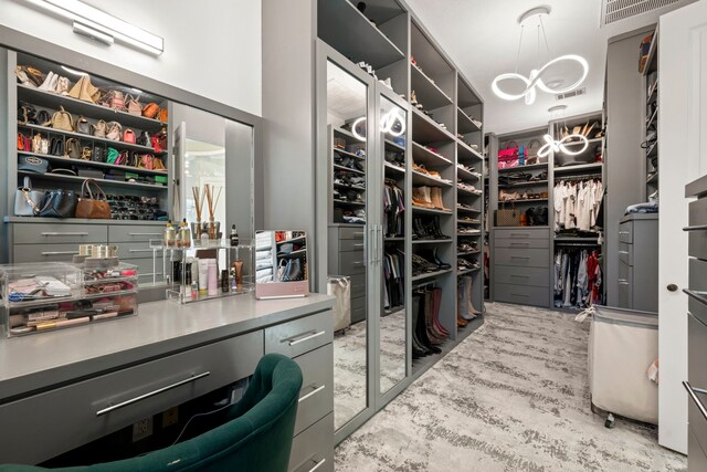 3702 Deerbend Ct, Spring, TX 77386 - walk in closet with a chandelier