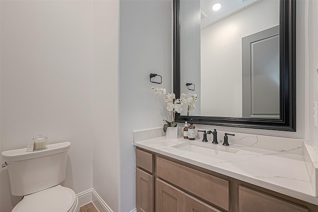 10615 Painted Crescent Ct, Cypress, TX 77433 - bathroom featuring toilet, vanity, and baseboards