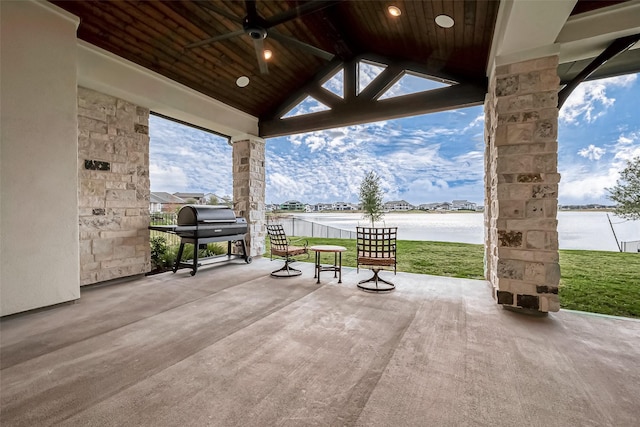10615 Painted Crescent Ct, Cypress, TX 77433 - view of patio / terrace featuring a water view, a ceiling fan, and area for grilling