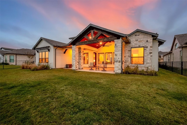 10615 Painted Crescent Ct, Cypress, TX 77433 - rear view of property featuring stone siding and a patio