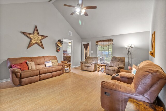 11664 Fm 92, Silsbee, TX 77656 - living room with high vaulted ceiling, a ceiling fan, wood finished floors, baseboards, and beamed ceiling