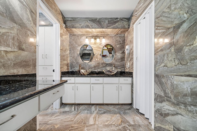 234 Willowbend St, Huntsville, TX 77320 - full bath with double vanity, marble finish floors, and backsplash
