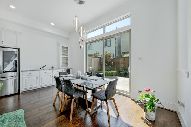 11015 Ayrshire Park Ln, Houston, TX 77043 - dining area featuring dark wood finished floors, recessed lighting, and ornamental molding