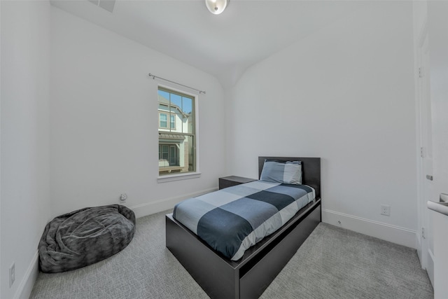 11015 Ayrshire Park Ln, Houston, TX 77043 - carpeted bedroom with baseboards and vaulted ceiling