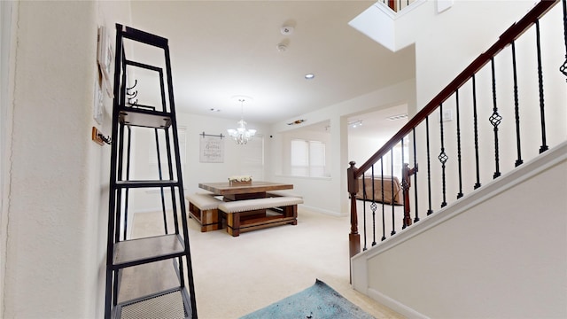 2702 Skyview Moon Dr, Houston, TX 77047 - carpeted foyer entrance with a chandelier, stairway, and baseboards