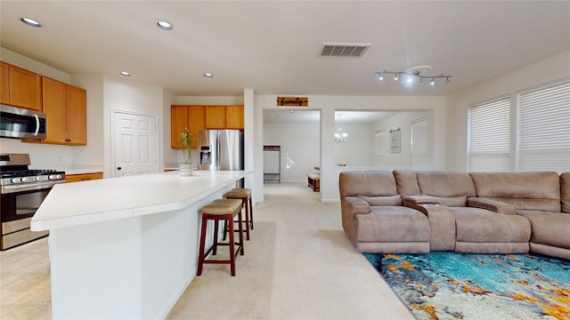 2702 Skyview Moon Dr, Houston, TX 77047 - living area with recessed lighting, a chandelier, and light carpet