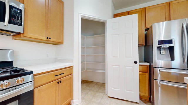 2702 Skyview Moon Dr, Houston, TX 77047 - kitchen with appliances with stainless steel finishes and light countertops