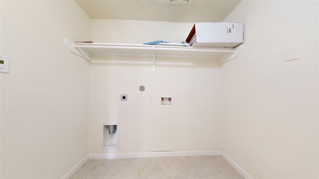 2702 Skyview Moon Dr, Houston, TX 77047 - clothes washing area with hookup for an electric dryer, washer hookup, baseboards, and hookup for a gas dryer