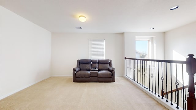 2702 Skyview Moon Dr, Houston, TX 77047 - living area featuring carpet floors, baseboards, an upstairs landing, and recessed lighting