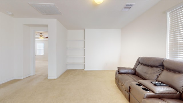 2702 Skyview Moon Dr, Houston, TX 77047 - living room featuring light carpet, baseboards, and ceiling fan