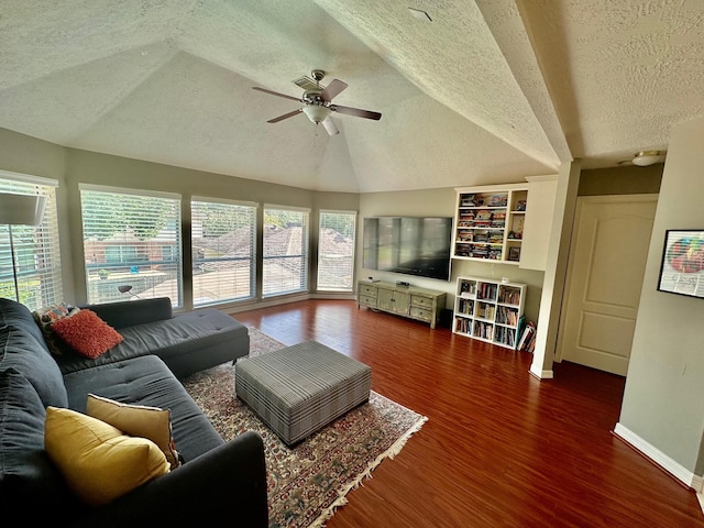 19203 Yearling Mdws, Houston, TX 77094 - living room with a textured ceiling, ceiling fan, wood finished floors, vaulted ceiling, and baseboards