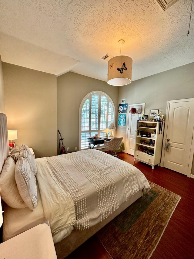 19203 Yearling Mdws, Houston, TX 77094 - bedroom with a textured ceiling and wood finished floors