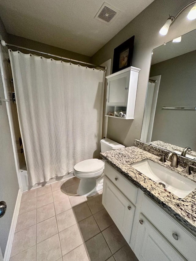 19203 Yearling Mdws, Houston, TX 77094 - full bath featuring toilet, tile patterned flooring, vanity, and a shower with shower curtain