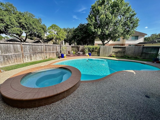 19203 Yearling Mdws, Houston, TX 77094 - view of swimming pool with a patio, a fenced backyard, and an in-ground hot tub