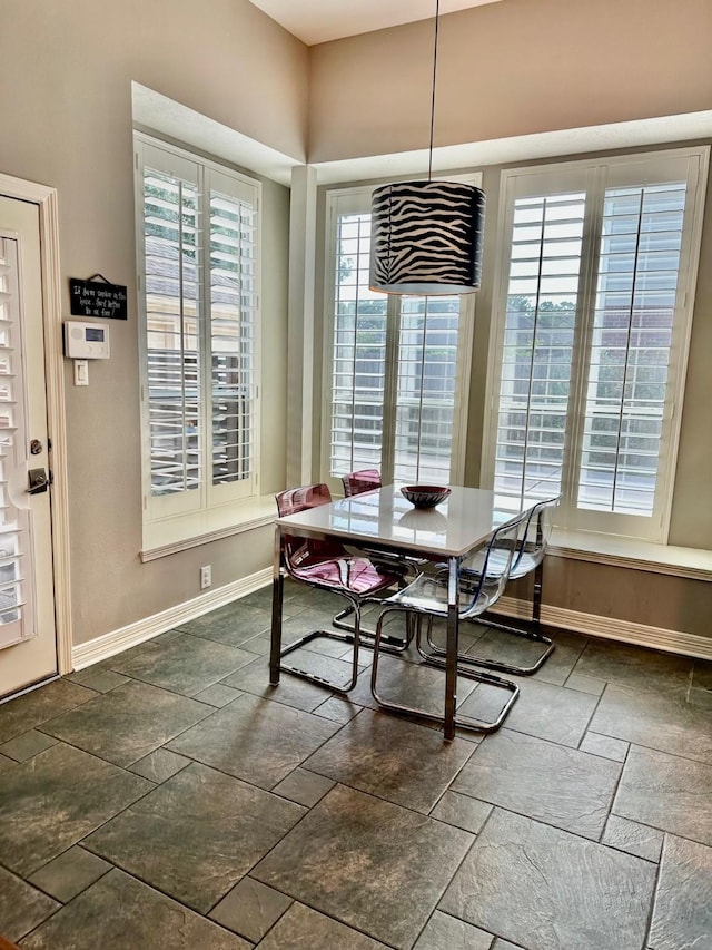 19203 Yearling Mdws, Houston, TX 77094 - dining room featuring stone tile flooring and baseboards