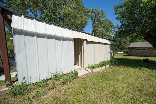 1191 Barnum Blvd, Corrigan, TX 75939 - view of green lawn featuring an outdoor structure