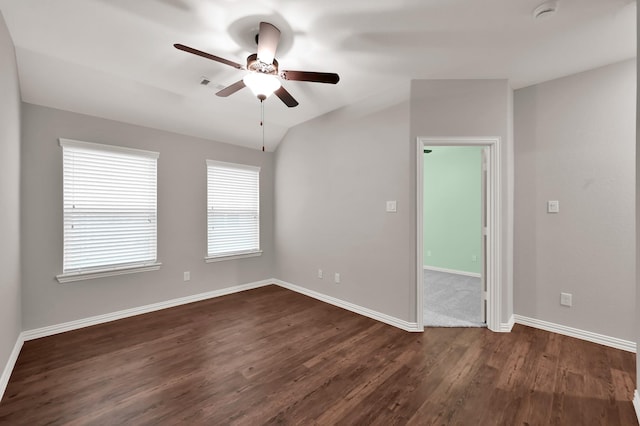 31766 Chapel Rock Ln, Spring, TX 77386 - spare room featuring a ceiling fan, dark wood-style floors, baseboards, a smoke detector, and lofted ceiling