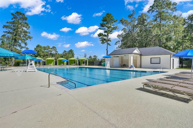 31766 Chapel Rock Ln, Spring, TX 77386 - community pool with a patio
