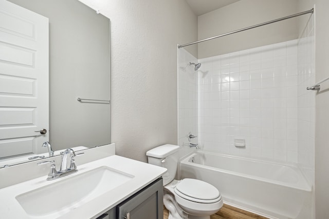 10292 Bayou Oaks Dr, Conroe, TX 77385 - bathroom with toilet, vanity, tub / shower combination, and a textured wall