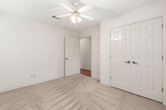 185 Rustic Way, Livingston, TX 77351 - unfurnished bedroom featuring carpet, baseboards, a closet, and a ceiling fan