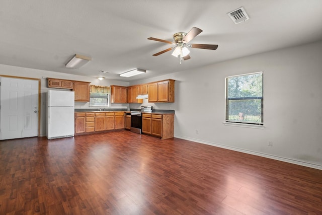 185 Rustic Way, Livingston, TX 77351 - kitchen featuring freestanding refrigerator, stainless steel range with electric cooktop, healthy amount of natural light, and a ceiling fan