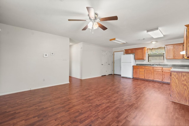 185 Rustic Way, Livingston, TX 77351 - kitchen with freestanding refrigerator, ceiling fan, dark wood-style flooring, baseboards, and open floor plan