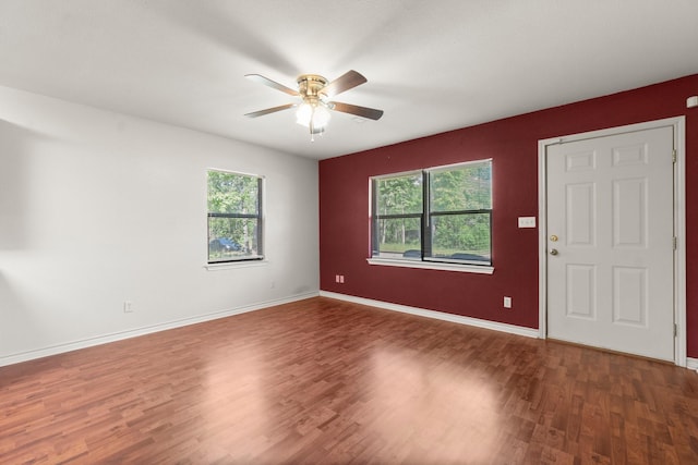 185 Rustic Way, Livingston, TX 77351 - empty room with ceiling fan, healthy amount of natural light, wood finished floors, and baseboards
