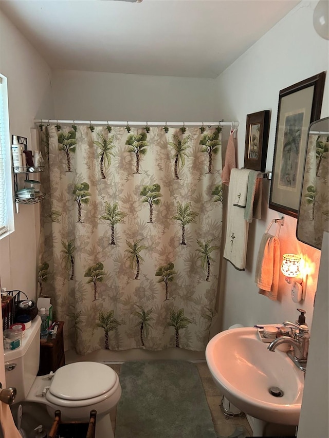26735 Saddle Rock Ln, New Caney, TX 77357 - bathroom with a sink, toilet, and tile patterned flooring