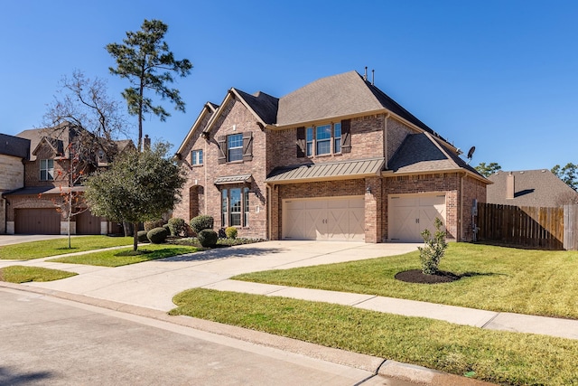 18011 Stari Most Ln, Houston, TX 77044 - view of front of property with brick siding, driveway, a garage, a standing seam roof, and a shingled roof