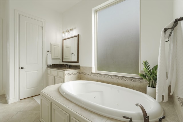 18011 Stari Most Ln, Houston, TX 77044 - full bathroom featuring a whirlpool tub, tile patterned floors, and vanity