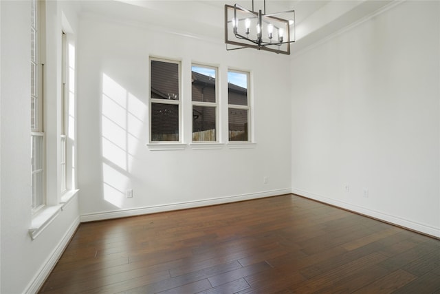 18011 Stari Most Ln, Houston, TX 77044 - empty room featuring a chandelier, dark wood-type flooring, baseboards, and crown molding