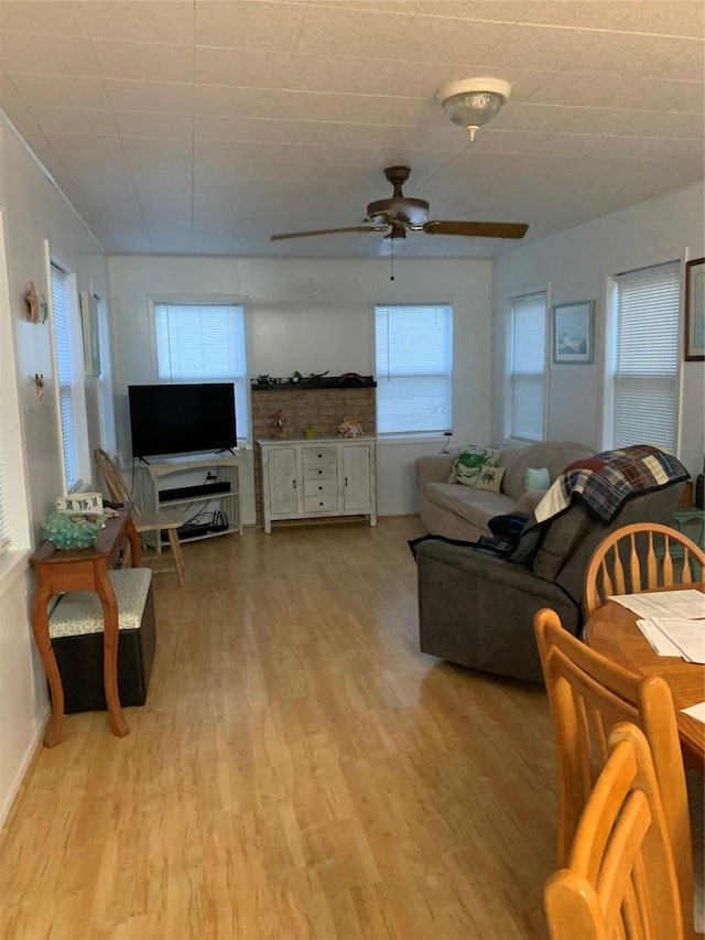 142 Seagull, Sargent, TX 77414 - living area with ceiling fan and light wood finished floors