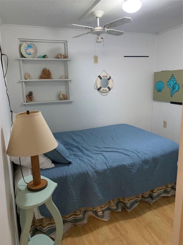 142 Seagull, Sargent, TX 77414 - bedroom featuring wood finished floors and a ceiling fan