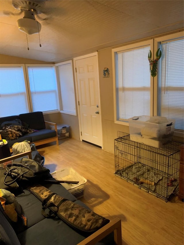 142 Seagull, Sargent, TX 77414 - living room featuring wood finished floors and lofted ceiling