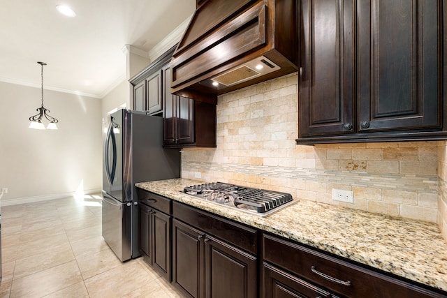 32 Evangeline Blvd, Conroe, TX 77304 - kitchen featuring ornamental molding, appliances with stainless steel finishes, custom range hood, baseboards, and dark brown cabinetry