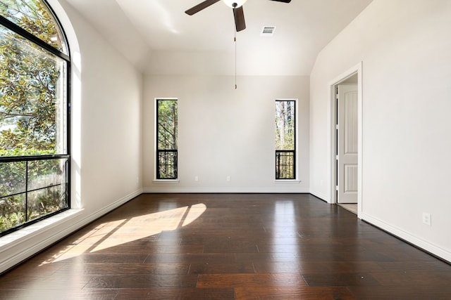 32 Evangeline Blvd, Conroe, TX 77304 - unfurnished room with healthy amount of natural light, lofted ceiling, ceiling fan, wood-type flooring, and baseboards
