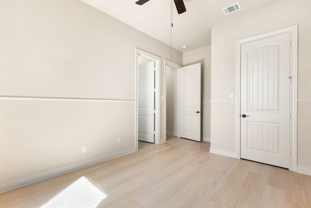 32 Evangeline Blvd, Conroe, TX 77304 - unfurnished bedroom featuring wood finished floors, baseboards, and ceiling fan