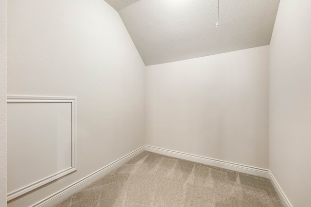 32 Evangeline Blvd, Conroe, TX 77304 - bonus room with lofted ceiling, carpet flooring, and baseboards