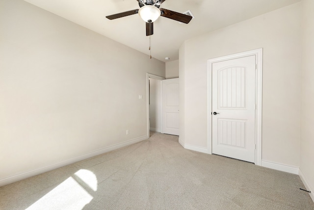 32 Evangeline Blvd, Conroe, TX 77304 - unfurnished bedroom with light carpet, baseboards, and ceiling fan