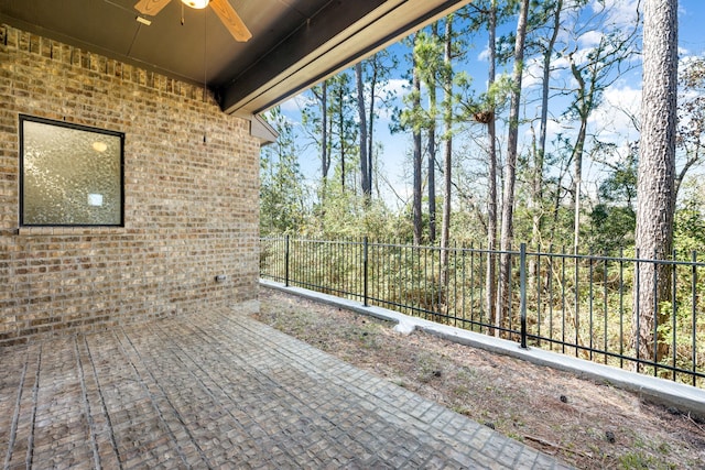 32 Evangeline Blvd, Conroe, TX 77304 - wooden terrace featuring ceiling fan and a patio area