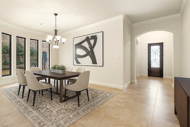 32 Evangeline Blvd, Conroe, TX 77304 - dining area featuring ornamental molding, arched walkways, a chandelier, light tile patterned floors, and baseboards