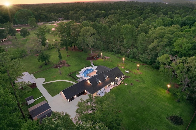15232 Saddlewood Dr, Conroe, TX 77384 - aerial view at dusk of a wooded view